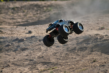 rc monster truck model with wheels in air