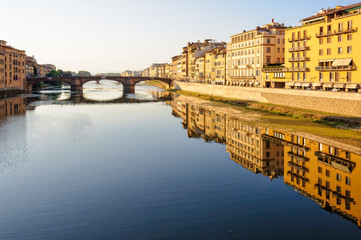 Fototapeta premium Santa Trinita bridge and Acciaiuoli embankment (lungarno) in the late afternoon sun - Florence, Tuscany, Italy