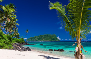 Panorama of vibrant tropical Lalomanu beach on Samoa Island with palm trees