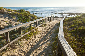 sandy walkway to a beach