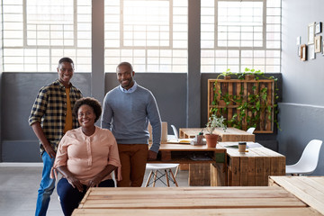 Smiling African coworkers taking a break in a modern office
