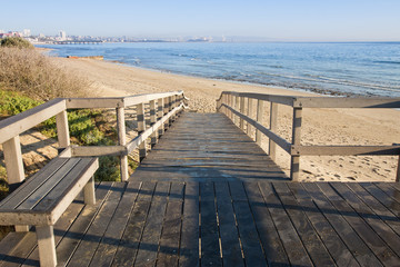 Fototapeta na wymiar Wooden walkway onto a beach