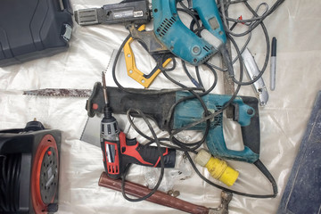 Collection of used power tools, DIY repair equipment.