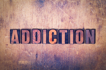 Addiction Theme Letterpress Word on Wood Background