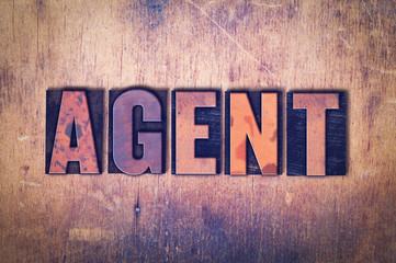 Agent Theme Letterpress Word on Wood Background