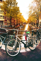 Fototapeta na wymiar Bikes on the bridge in Amsterdam, Netherlands.