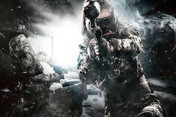 Heavily armed masked paintball soldier on post apocalyptic background. Ad concept.