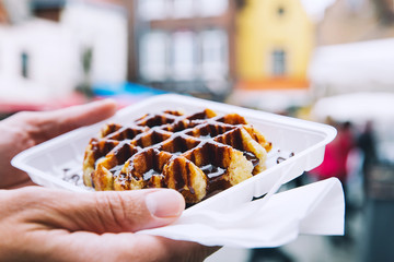 Fototapeta premium Traditional Belgian dessert, pastry - Belgium tasty waffle with chocolate sauce