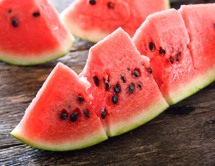 watermelon sliced on wooden background