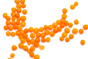 Red lentils on a white background