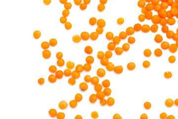Red lentils on a white background