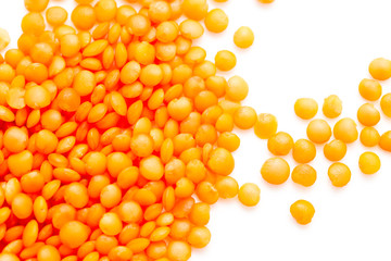 Red lentils on a white background