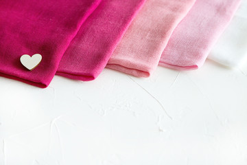 Pink Textile Palette on White Background and Wooden Hearts Card Gift Place for a Text Holiday Concept