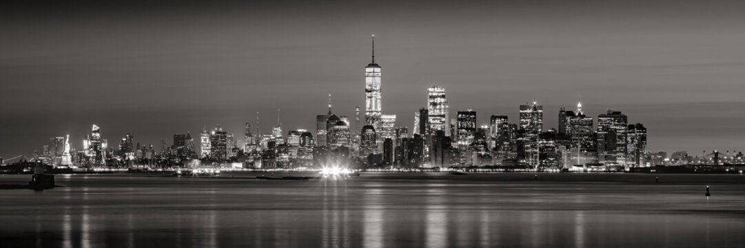 Panoramic view of Lower Manhattan Financial District skyscrapers in Black & White at dawn from New York City Harbor