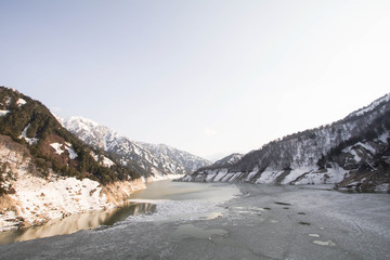 Dam at Tateyama Kurobe Alpine Route the snow mountains wall