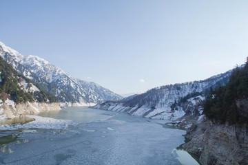 Dam at Tateyama Kurobe Alpine Route the snow mountains wall