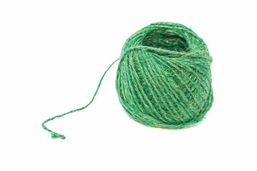 Linen thread of green color on a white background