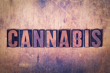 Cannabis Theme Letterpress Word on Wood Background