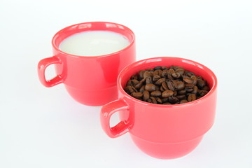 Two cups with coffee and milk