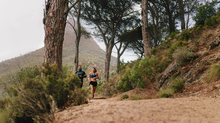 Fototapeta premium Couple of runners working out in beautiful nature