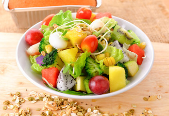 vegetable salad bowl on wooden background