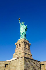 Statue of Liberty at perfect weather conditions blue sky copper torch