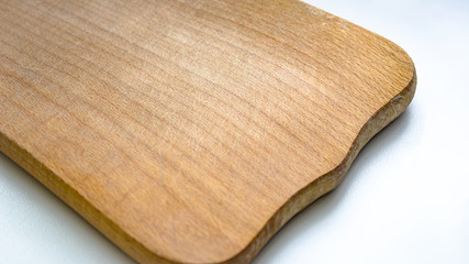 Wooden cutting board with texture on a white background