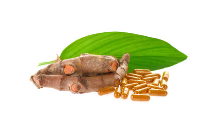 Turmeric capsule on white background