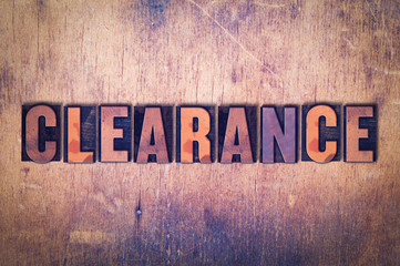 Clearance Theme Letterpress Word on Wood Background