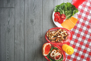 Summer cooking tabletop with homemade hamburgers and frenchfries