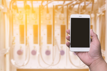 hand holding blank screen smartphone with blurred background IT equipment for concept IT, digital equipment, online concept.