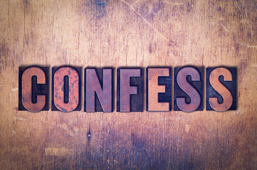 Confess Theme Letterpress Word on Wood Background