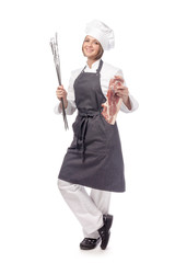 smiling woman professional chef, cook or butcher holding raw meat steak and grill tools isolated on white background. restaurant, dieting, bbq and cooking food concept. grocery advertisement