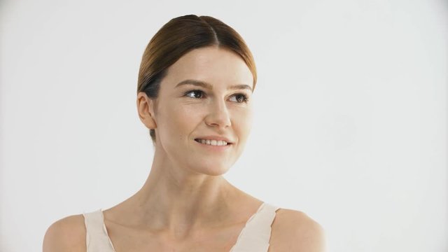 Cosmetics. Sexy Female Model Caressing Healthy Facial Skin