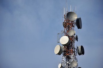 telecommunication pole with blue sky background