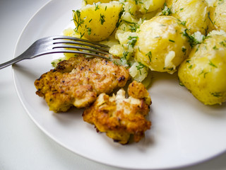 Chicken steak and potatoes on the plate