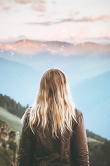 Young Woman enjoying sunset mountains landscape Travel Lifestyle wanderlust concept adventure summer vacations outdoor girl traveler blonde hair harmony with nature