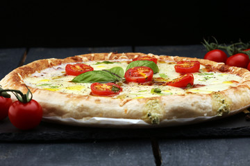 Hot true PEPPERONI ITALIAN PIZZA with salami and cheese. TOP VIEW Tasty traditional pepperoni pizza on board on wooden table with decoration