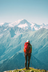 Woman Traveler standing at mountains nature landscape with backpack Travel Lifestyle concept...