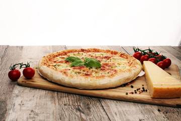 Hot true PEPPERONI ITALIAN PIZZA with salami and cheese. TOP VIEW Tasty traditional pepperoni pizza on board on wooden table with decoration