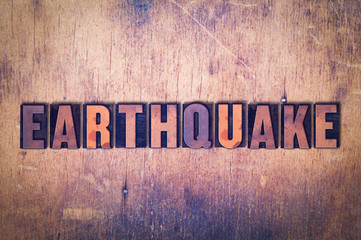 Earthquake Theme Letterpress Word on Wood Background