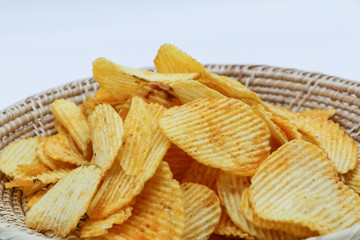 Potato fries or  French fries in a basket  isolated on white backgroundใ