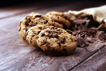 Chocolate cookies on wooden table. Chocolate chip cookies shot