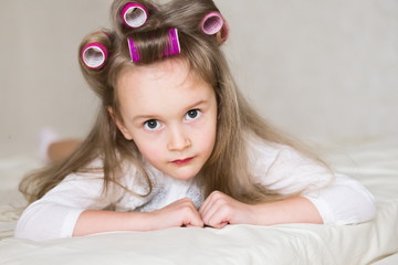little girl face, curlers, close up