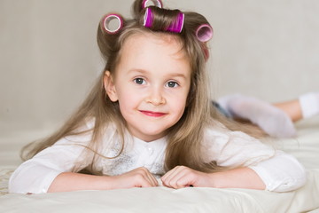 little girl face, curlers, close up