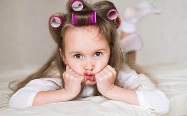 little girl face, curlers, close up