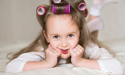 little girl face, curlers, close up