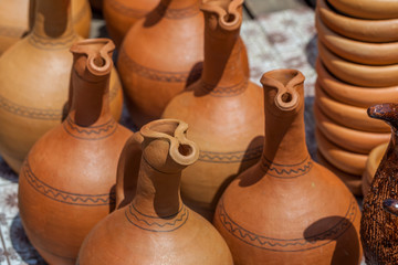 Fototapeta na wymiar Traditional Georgian clay jugs for sale in the village of Shrosha, Georgia