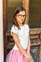 Fototapeta premium Preteen girl with teeth braces wearing beautiful dress and eyeglasses