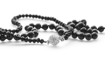 Fashion jewelry beautiful black beads on white background